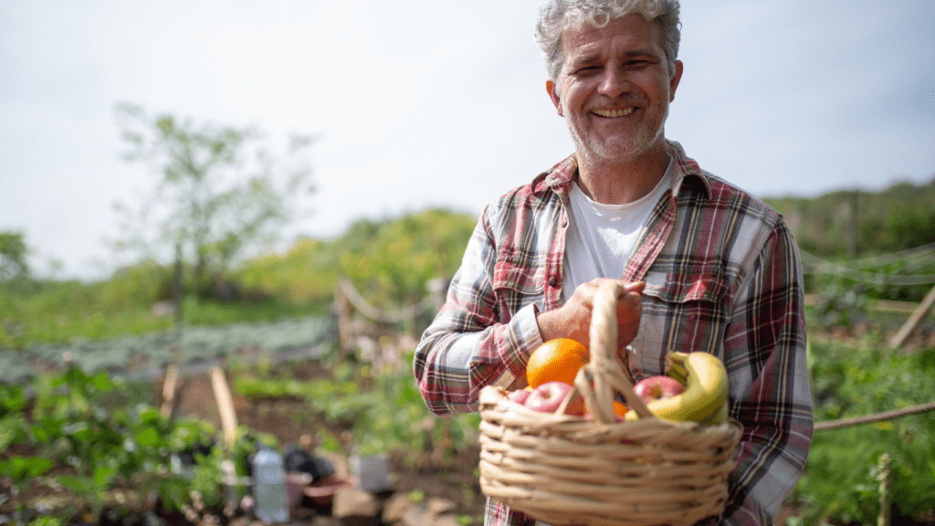 A person holding a basket of fruits