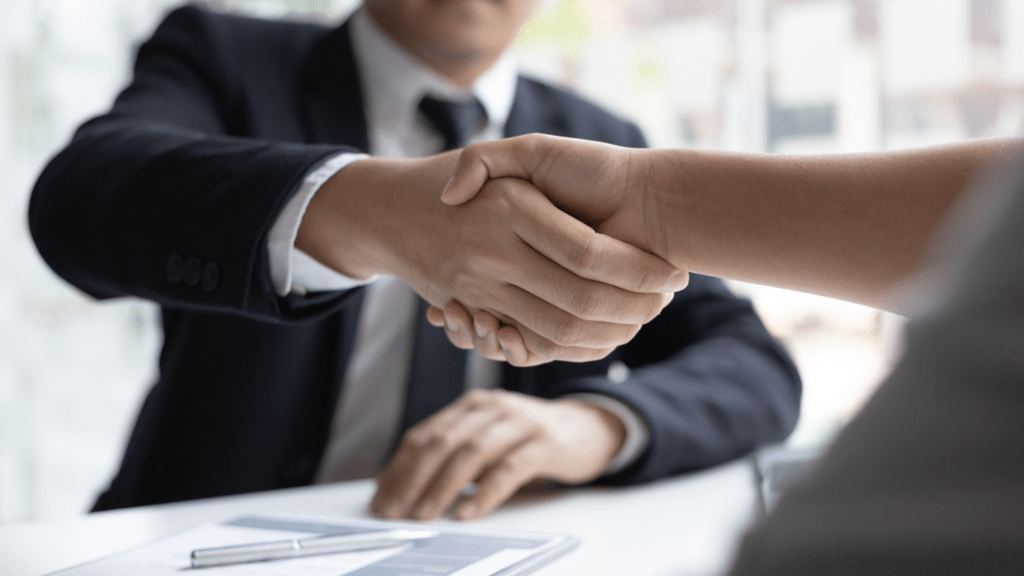 hired applicant shaking hands