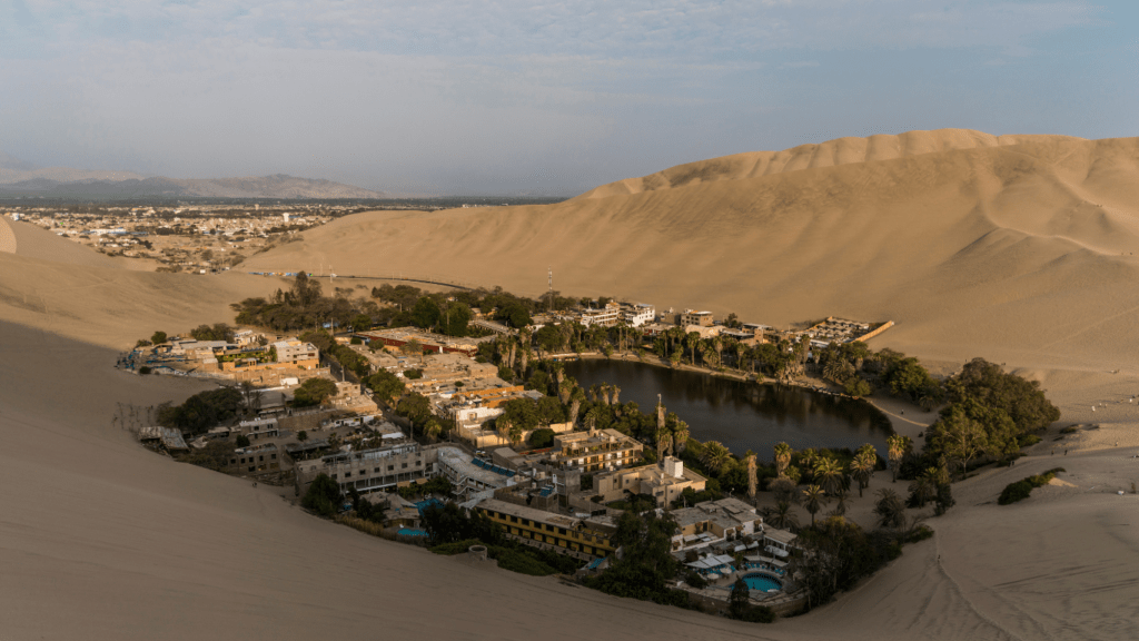 an aerial view of a large sand dune in the middle of a desert