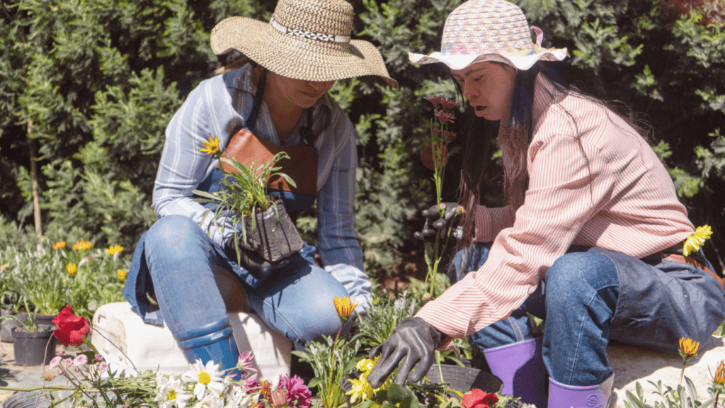 two people are working in the garden together