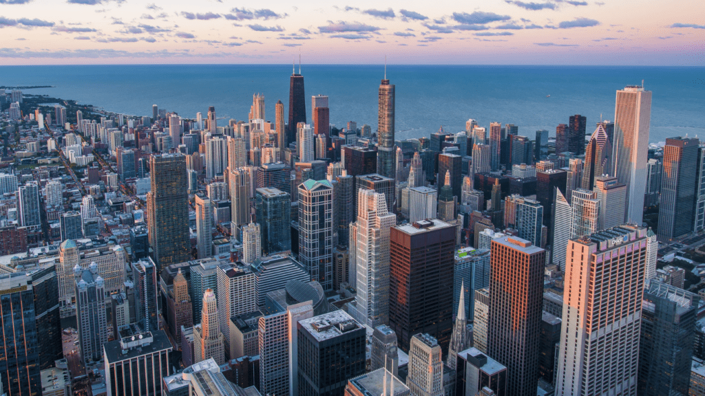 an aerial view of the Chicago skyline at sunset