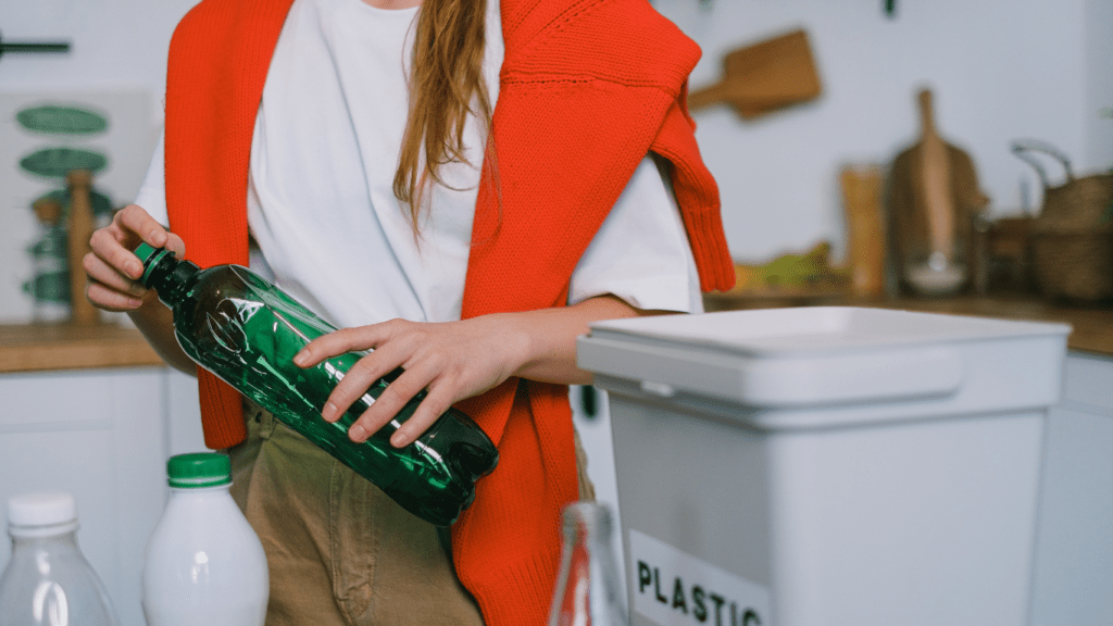 a person holding a plastic bottle