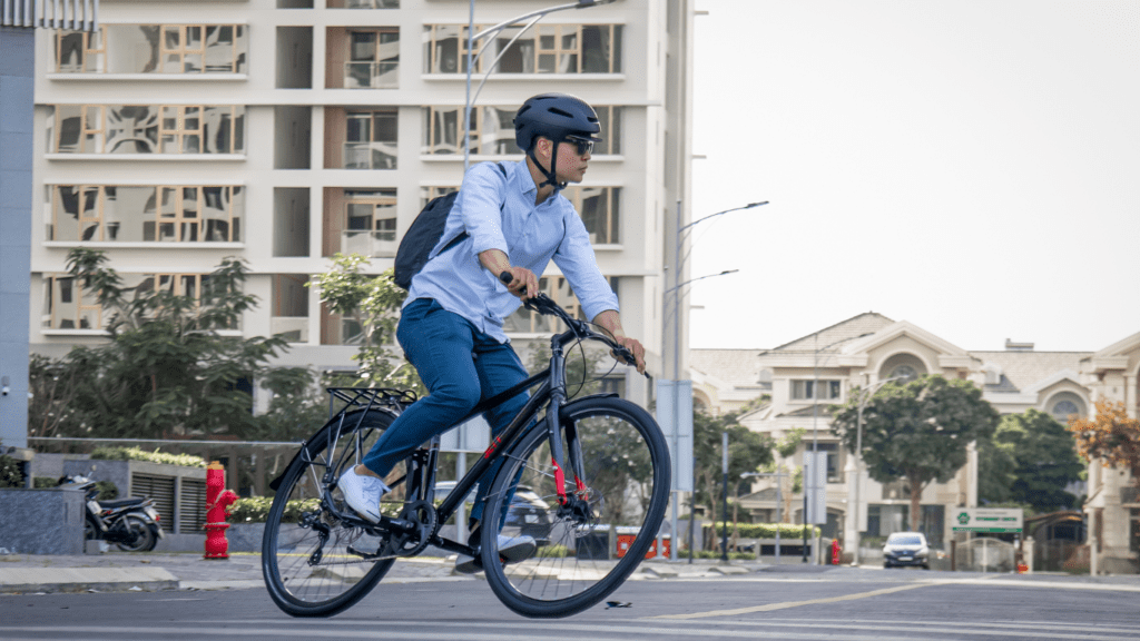 a person riding a bike down an empty street