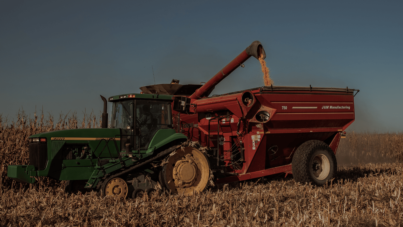 an tractor sits in the middle of a field