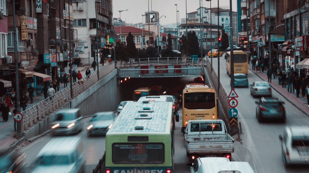 traffic on a busy city street with buses and cars